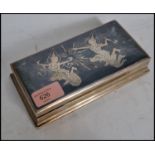 A 20th century vintage Siam sterling silver table top cigarette case with scenes of deity's to the