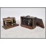 A good Victorian Jones sewing machine complete in the wooden carry case together with a later