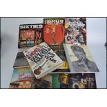 A good collection of Music and popular culture books to include A Pictorial History Of Striptease.