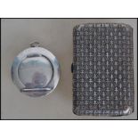 A silver tested ladies vanity compact of circular form having a hinged mirror lid revealing a