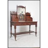 An Edwardian mahogany duchess dressing table raised on turned legs with reeded drawers to front.