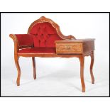 A 20th century Italian mahogany rococo telephone table raised on shaped legs having a red velour