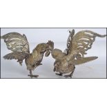 A 20th century pair of good silver plate fighting cocks - cockerel, both in differing aggressive