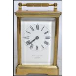 A vintage early 20th century French brass cased carriage clock retailed by William Bruford and Son