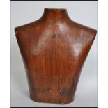 A vintage 20th century upper torso male mannequin of wooden construction having bold notation to