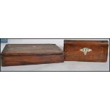 A Victorian wooden writing slope having an ebonised fitted interior, multiple compartments, with