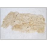 A vintage retro 20th century goat skin / hide / fleece. The fleece having a very deep deep pile