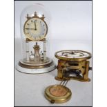 A vintage early 20th century Kaiser German glass domed anniversary mantle clock having a white