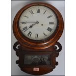A 19th century American mahogany wall clock with Roman numerals, crossbanding and carved