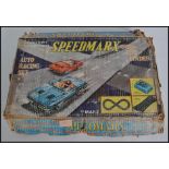 A vintage Speedmarx toy set complete with the original box to include track and cars etc ( please