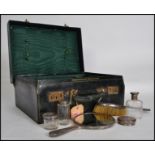 A gentlemans / ladies vanity case with silver hallmarked contents to include  bottles, pots,
