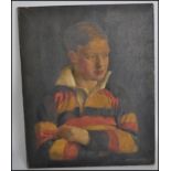 An early 20th century oil on canvas portrait painting of a young chap in a yellow, red and black