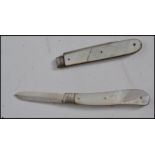Two silver hallmarked mother of pearl handled fruit knives one being hallmarked for Sheffield 1922