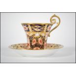 A Royal Crown Derby cup and saucer in the 2451 Imari pattern bearing Osmaton factory marks c.