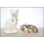 A Royal Crown Derby collectors guild exclusive catnip kitten paperweight with gold crown stopper