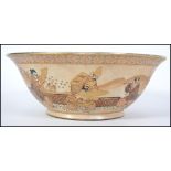 A believed 19th century Japanese Satsuma bowl having geometric patterns to the borders with warriors