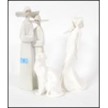 A LLadro Nun figurine group along with a Royal Doulton Images Of Nature cat figurine and a Royal