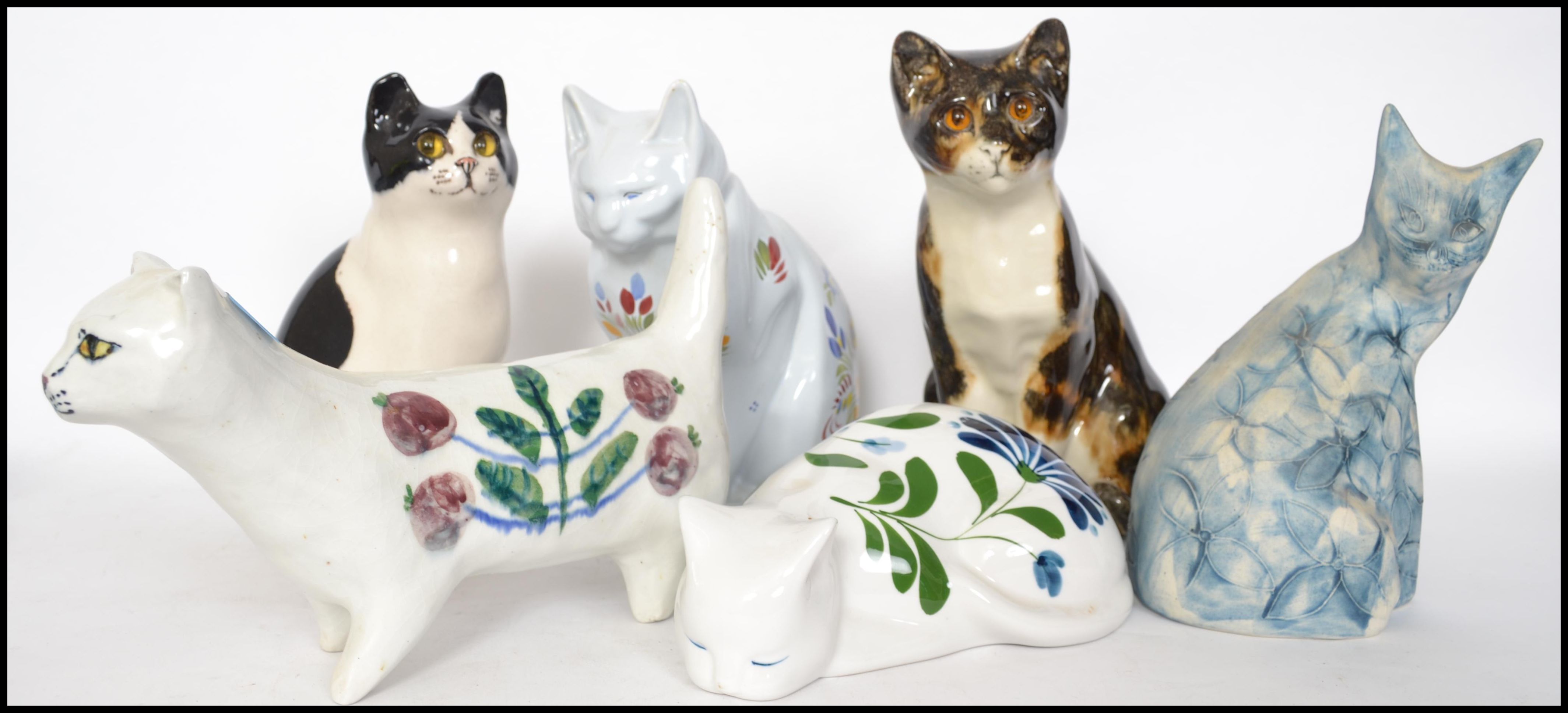 A group of ceramic cats to include a HB Henriot Quimper cat, a Dansk cat, a large Minton cat with