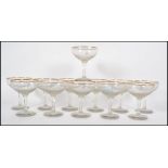 A set of 12 vintage 1950s hexagonal stem Babycham glasses with white fawns. Measures 11cms high.