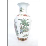 A large 18th /19th century Chinese Kangxi vase of baluster form decorated with famille rose patterns