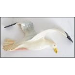 A Beswick wall hanging plaque in the form of a large flying Seagull stamped to rear Beswick 658/1.