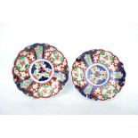 A pair of 20th century Chinese Imari pattern dishes in poly-chrome colours of red, blue and white