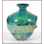 A vintage 20th century Mdina studio art glass vase of baluster form having a waisted neck having