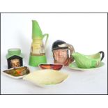 A collection of ceramics to include two Poole gemstone / fat lava pin trays, Carlton Ware leaf