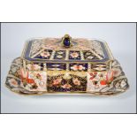 An early 20th century Royal Crown Derby lidded butter / pilchard dish in the 2451 Imari pattern