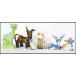 A group of ceramic cats and donkeys to include Rye Monastery cat, Kilkenny cat, Szeilfr cat, Royal
