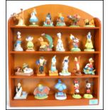 A collection of 23 Walt Disney ceramic characters to include Micky and Minnie, Bambi, Snow White,