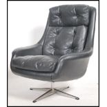 A 1960's Parker Knoll large batwing swivel egg cha