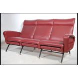 A good 1970's Italian red faux leather upholstered