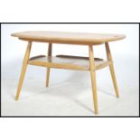 A rare vintage Ercol butler / tray table designed