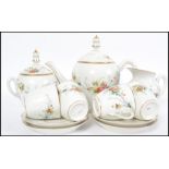 A believed 19th century porcelain tea service bear