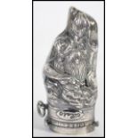 An unusual silver plated vesta case in the form of