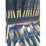 A 20th century oak cased canteen of cutlery having