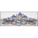 An Oriental ceramic 12 person eggshell tea service
