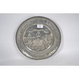 A believed circa 1820s pewter plate with embossed