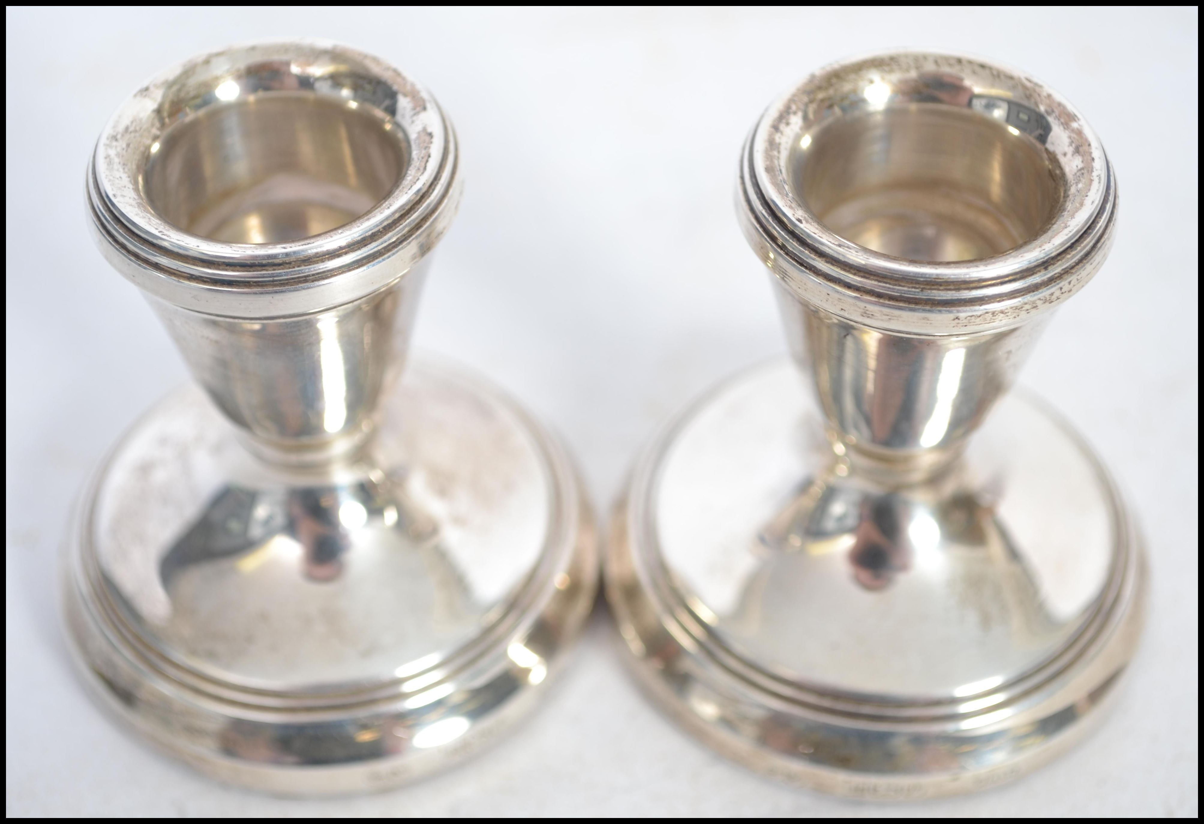 A pair of hallmarked silver candlesticks of squat - Image 6 of 6