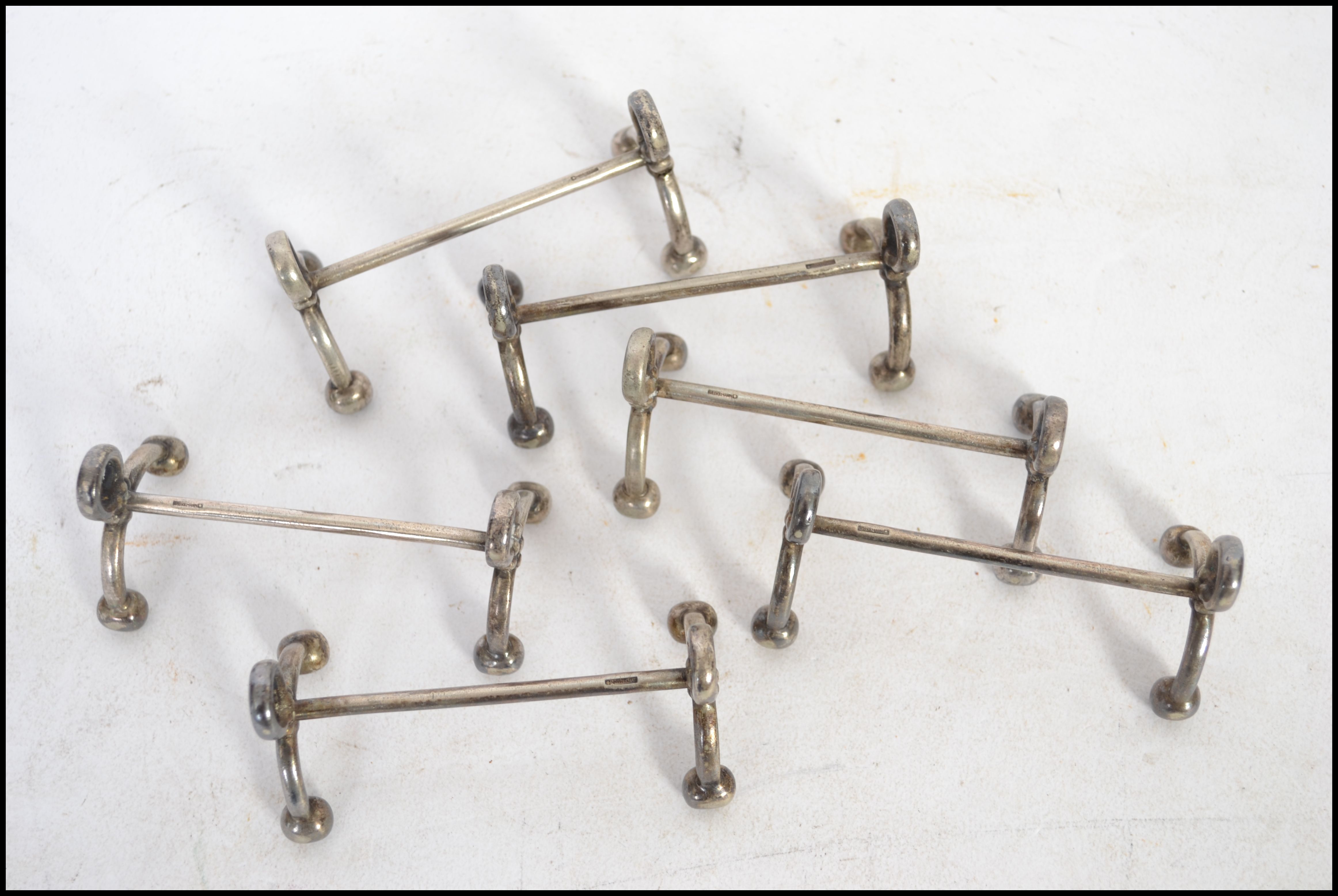 A set of silver plated knife rests having bow legs - Image 3 of 7