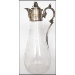 A Georgian cut glass claret jug having a silver pl