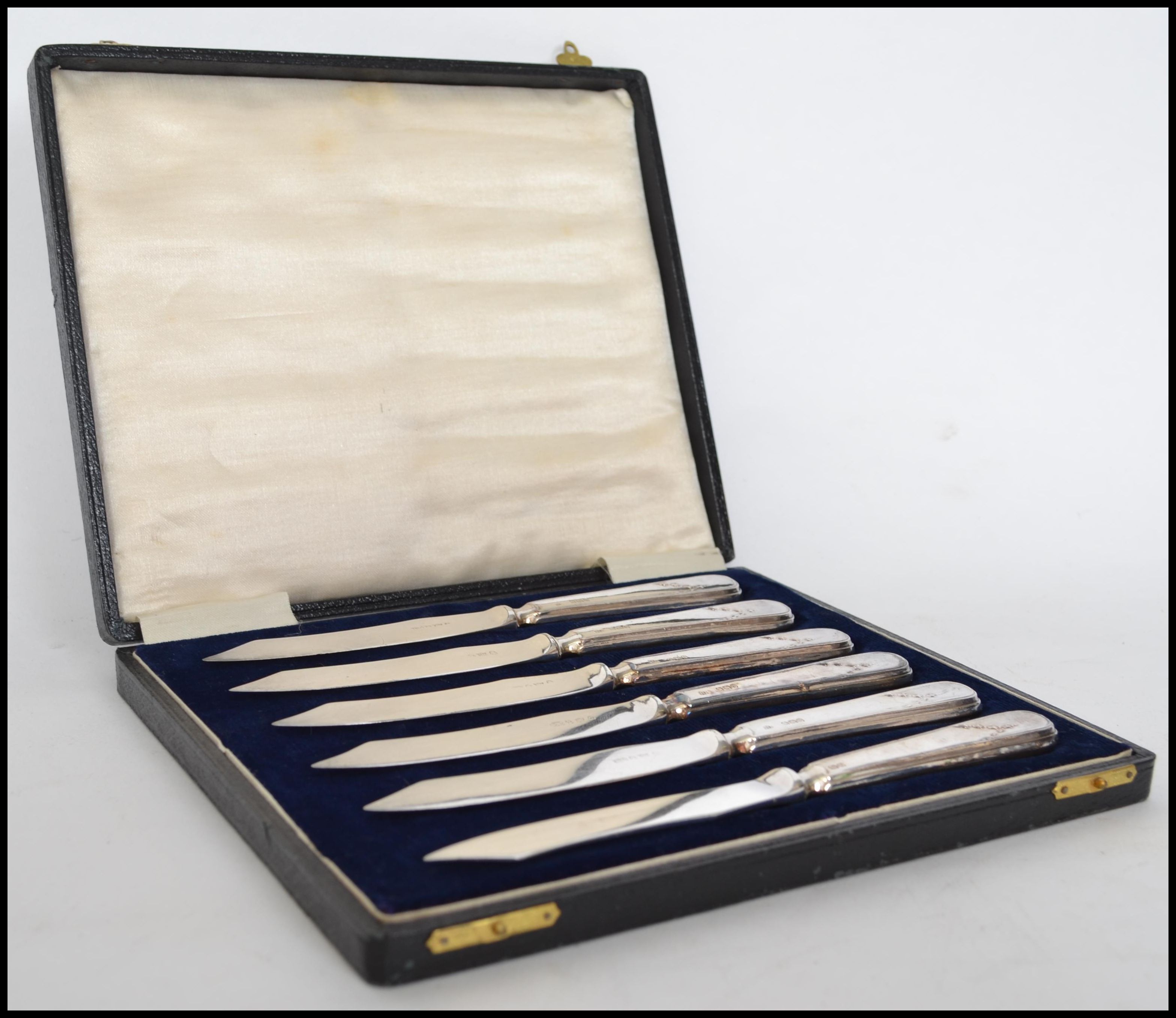A cased set of 6 silver hallmarked knives complete