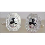 A pair of contemporary silver and enamel set gentl
