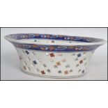 A Chinese decorative fret pierced bowl having an a