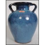 A large 20th century studio art pottery three hand
