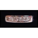 An 18ct white gold and diamond ladies half eternity ring, the diamonds approx 1ct approx being