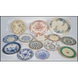 A large collection of Victorian and other ceramic plates and trays of varying patterns to include