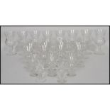 A group of cut lead crystal glass Edinburgh Thistle drinking glasses each raised on plain bases with