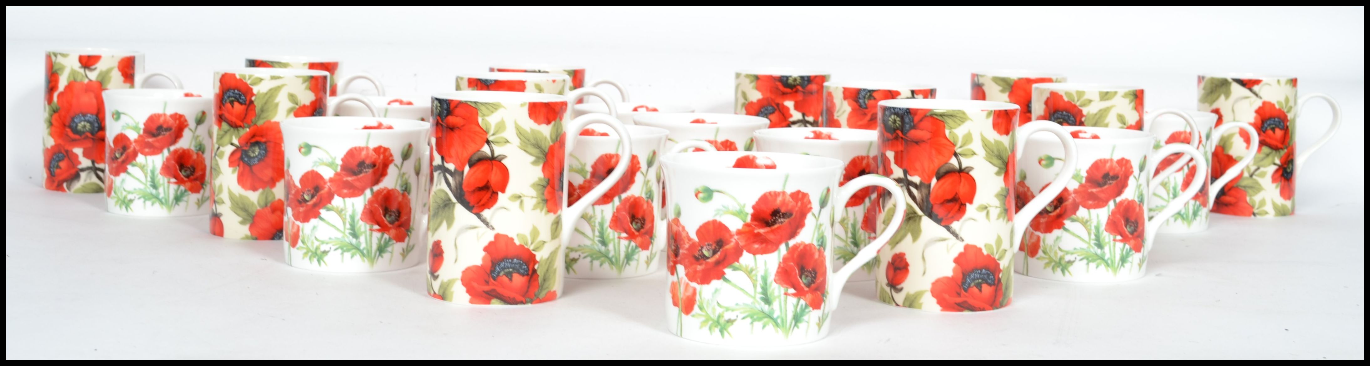 A good group of ceramic twelve coffee cups and 10 tea cups all with poppy flower design. Makers